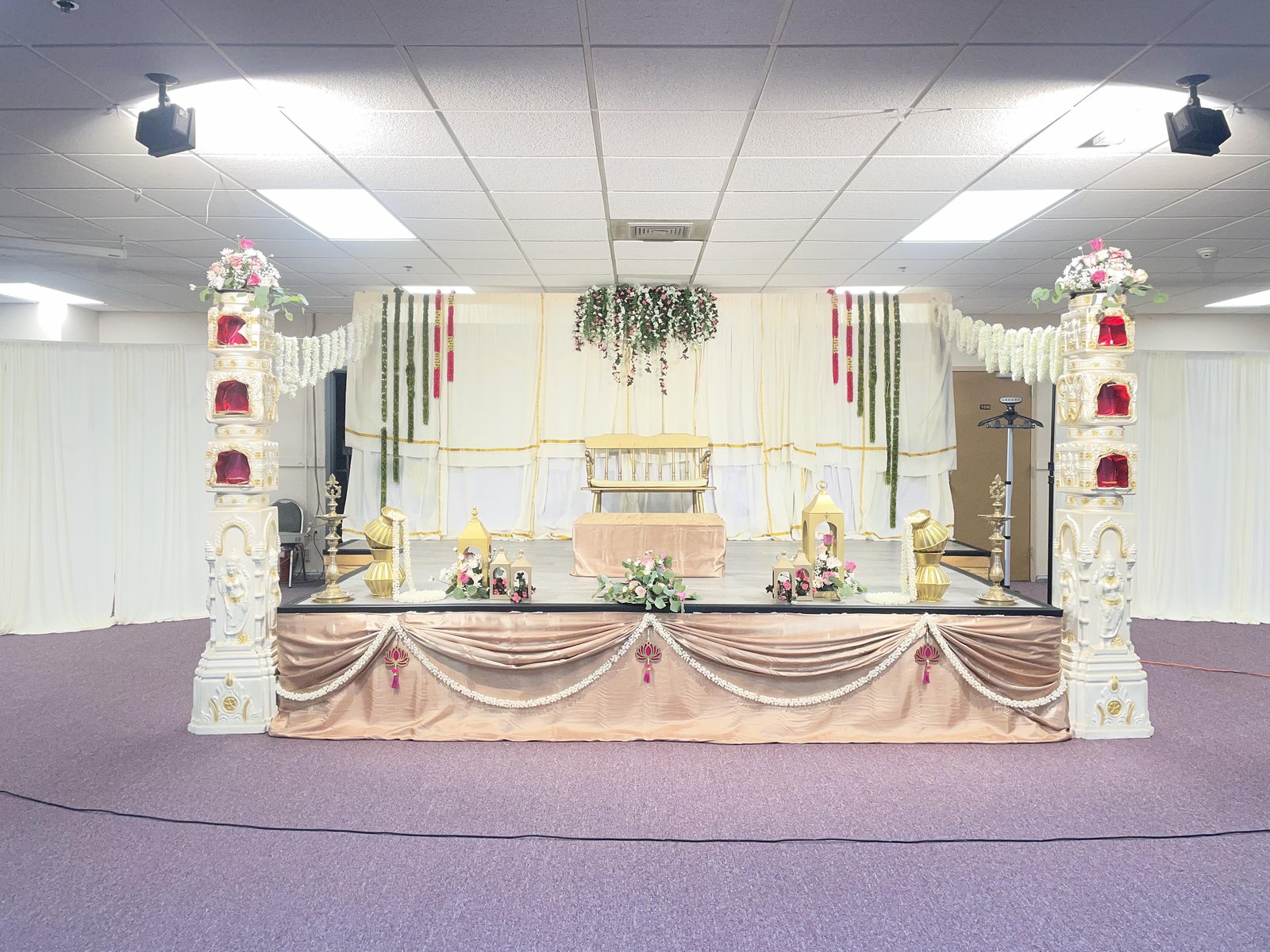 Decorated performance stage with traditional pillars