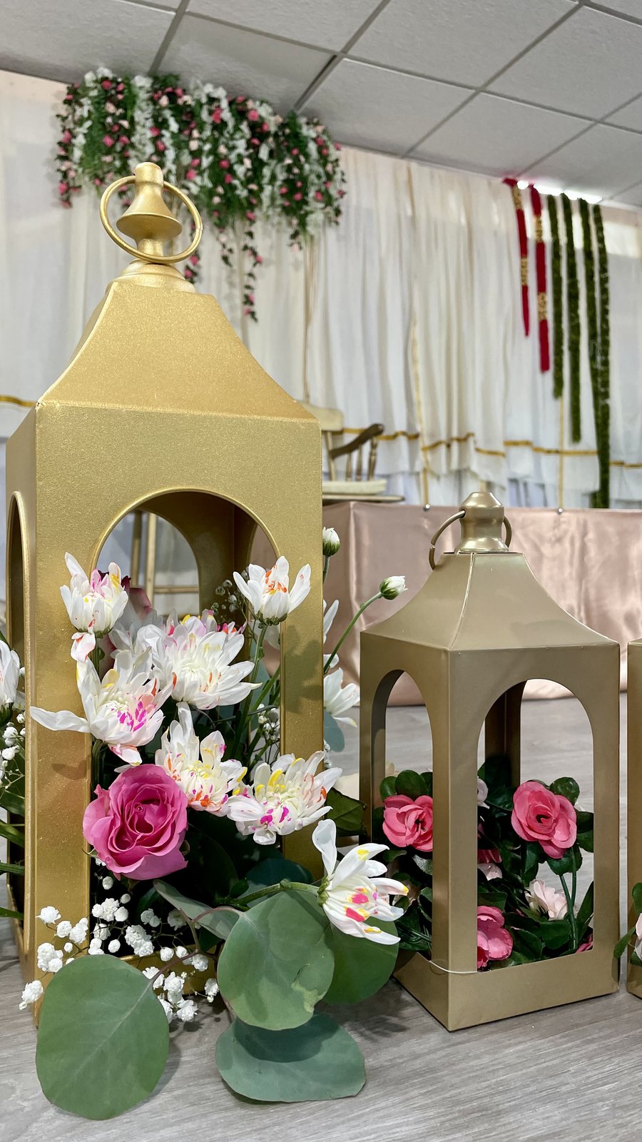 Gold lanterns with roses and warm florals