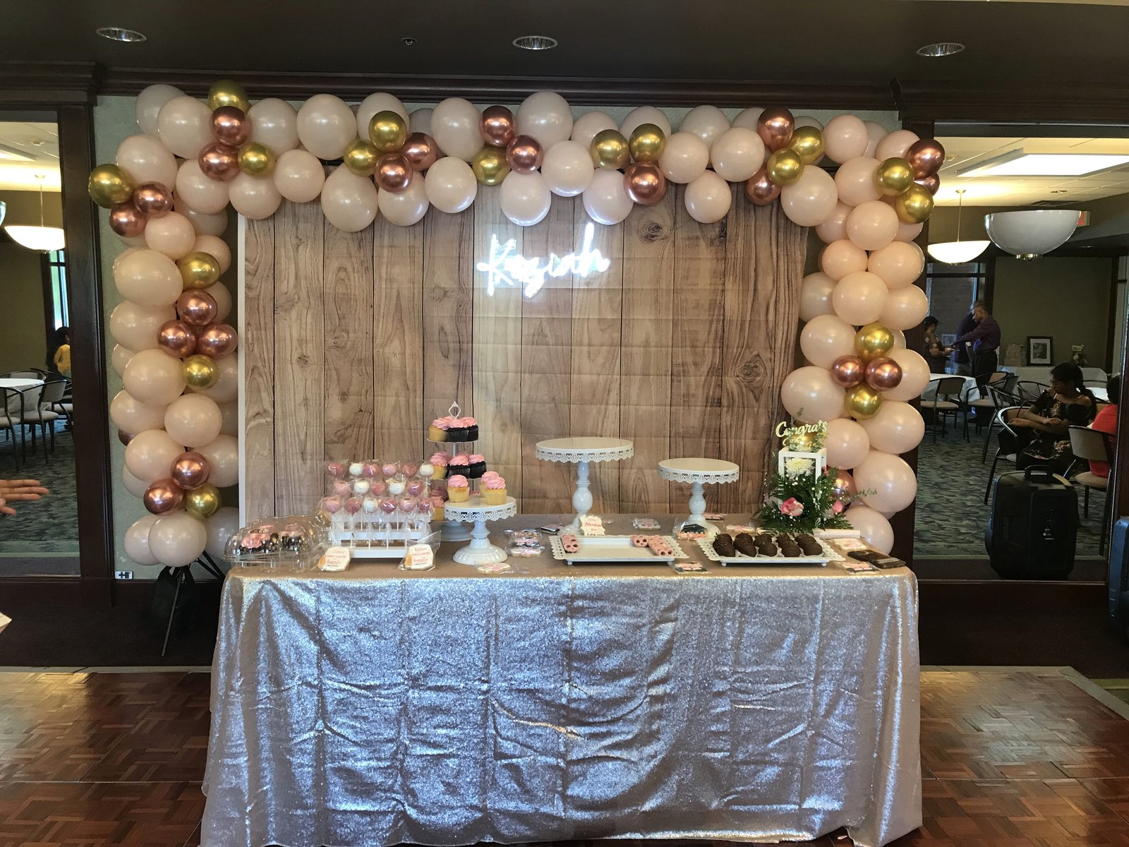 Graduation dessert table with rose gold styling